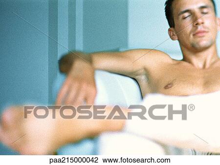 Shirtless man sitting, eyes closed View Large Photo Image Stock Image - Shirtless man sitting, eyes closed. Fotosearch