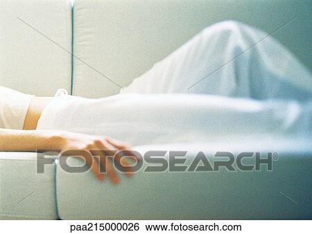 Woman lying on sofa, mid section View Large Photo Image Stock Photograph - Woman lying on sofa, mid section. Fotosearch