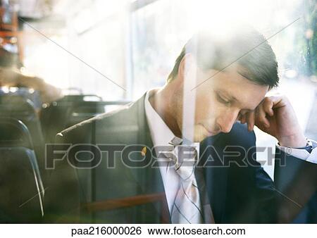 Businessman with head down on bus. View Large Photo Image Stock Photograph - Businessman with head down on bus.. Fotosearch
