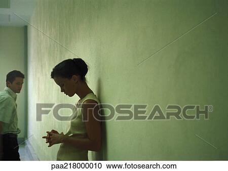 Couple in front of wall. View Large Photo Image Stock Image - Couple in front of wall.. Fotosearch