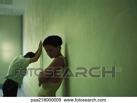 Couple leaning against wall. View Large Photo Image Stock Photo - Couple leaning against wall.. Fotosearch