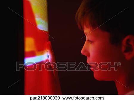 Little boy with hand on television, close-up. View Large Photo Image Stock Photo - Little boy with hand on television, close-up.. Fotosearch