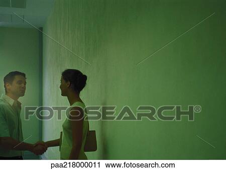 Man and woman shaking hands, blurred. View Large Photo Image Stock Image - Man and woman shaking hands, blurred.. Fotosearch