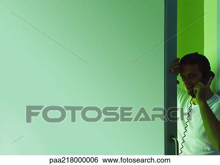 Man using telephone, blurred. View Large Photo Image Stock Photograph - Man using telephone, blurred.. Fotosearch