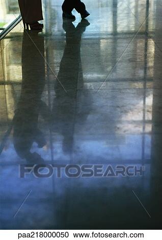Reflection of couple on shiny floor. View Large Photo Image Stock Image - Reflection of couple on shiny floor.. Fotosearch