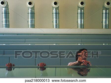 Woman on walkway, low angle. View Large Photo Image Stock Image - Woman on walkway, low angle.. Fotosearch