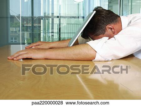 Businessman lying with face on laptop. View Large Photo Image Stock Photo - Businessman lying with face on laptop.. Fotosearch