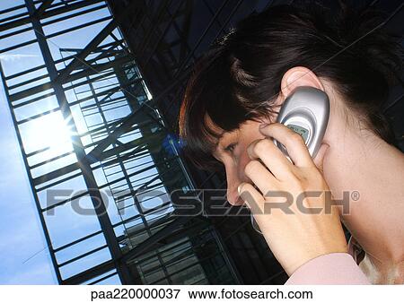 Young woman using cell phone, close-up. View Large Photo Image Stock Photo - Young woman using cell phone, close-up.. Fotosearch