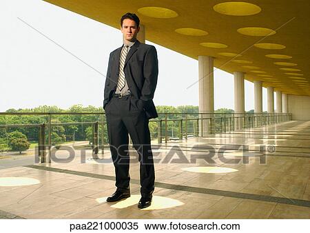 Businessman looking into camera View Large Photo Image Stock Photography - Businessman looking into camera. Fotosearch