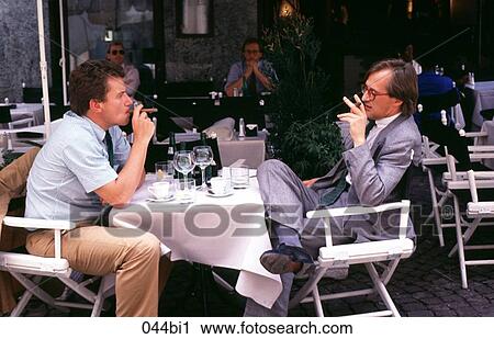 Businessmen Talking Over Cafe Table Germany View Large Photo Image Stock Image - Businessmen Talking Over Cafe Table Germany. Fotosearch