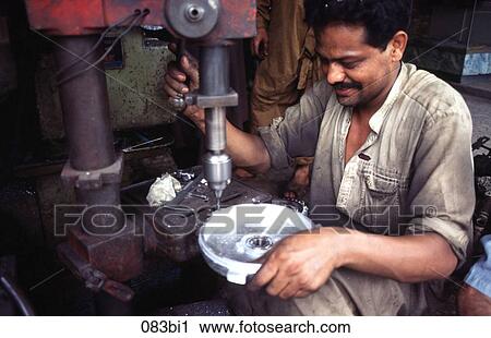 Machine Tool Operator Drilling a Metal Disc Pakistan View Large Photo Image Stock Image - Machine Tool Operator Drilling a Metal Disc Pakistan. Fotosearch
