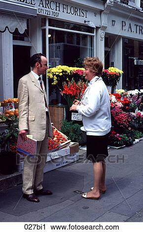 Man and Woman Talking in Street View Large Photo Image Stock Image - Man and Woman Talking in Street. Fotosearch