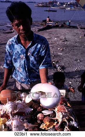 Stock Image - Trader Selling Shells Philippines. Fotosearch