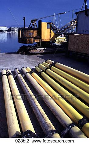 Stock Image - Abstract View of Yellow Pipes and a Crane Geneva Switzerland. Fotosearch