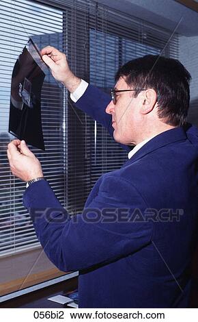 Businessman at Window Looking at Transparency View Large Photo Image Stock Image - Businessman at Window Looking at Transparency. Fotosearch