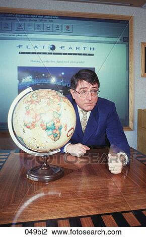 Businessman Sitting at Table with a Globe UK View Large Photo Image Stock Image - Businessman Sitting at Table with a Globe UK. Fotosearch
