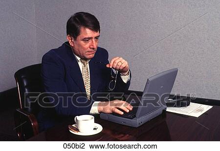 Businessman Working at Laptop Computer View Large Photo Image Stock Image - Businessman Working at Laptop Computer. Fotosearch