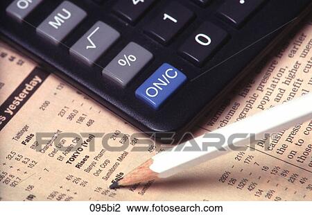 Stock Image - Close-up of Newspaper Calculator and Pencil. Fotosearch