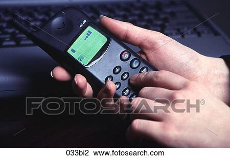 Close-up of Woman`s Hands Holding a Mobile Phone View Large Photo Image Stock Image - Close-up of Woman`s Hands Holding a Mobile Phone. Fotosearch