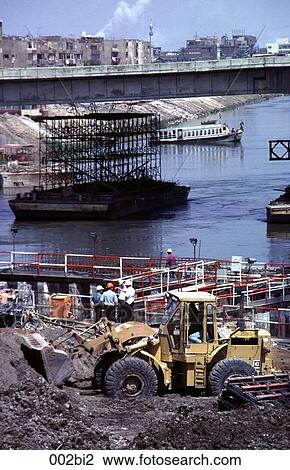Excavator by a Bridge under Construction Egypt View Large Photo Image Stock Image - Excavator by a Bridge under Construction Egypt. Fotosearch