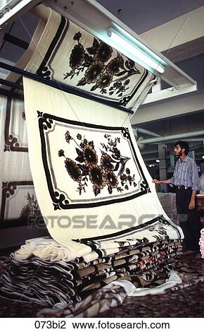 Man Inspecting Fabric on Machine Pakistan View Large Photo Image Stock Image - Man Inspecting Fabric on Machine Pakistan. Fotosearch