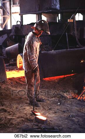 Stock Image - Man Working with Molten Steel South America. Fotosearch