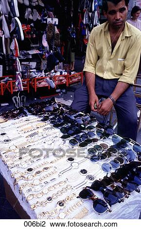 Stock Image - Street Trader Selling Sunglasses Europe. Fotosearch