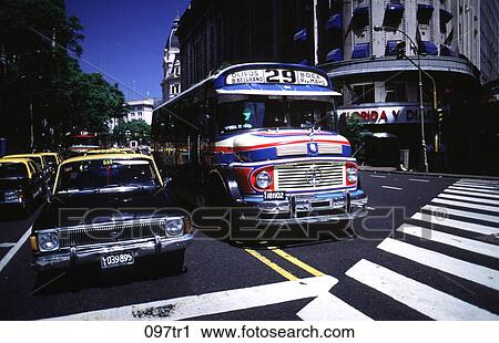 Stock Image - Bus and Taxi at Road Crossing Argentina. Fotosearch