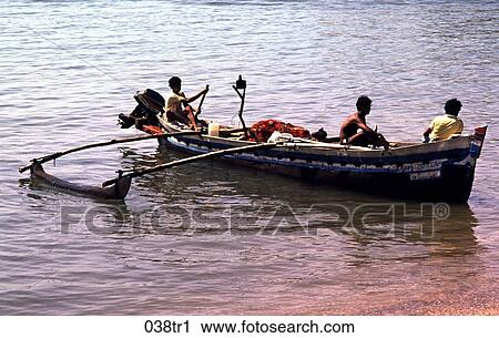 Fishermen Paddling in a Dugout Boat India View Large Photo Image Stock Image - Fishermen Paddling in a Dugout Boat India. Fotosearch