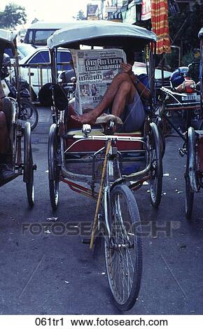 Man Reading a Newspaper in a Rickshaw Thailand View Large Photo Image Stock Image - Man Reading a Newspaper in a Rickshaw Thailand. Fotosearch
