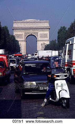 Stock Image - Traffic near the Arc de Triomphe Paris France. Fotosearch