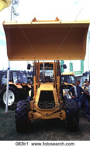 Yellow Tractor at Farm Equipment Exhibition View Large Photo Image Stock Image - Yellow Tractor at Farm Equipment Exhibition. Fotosearch