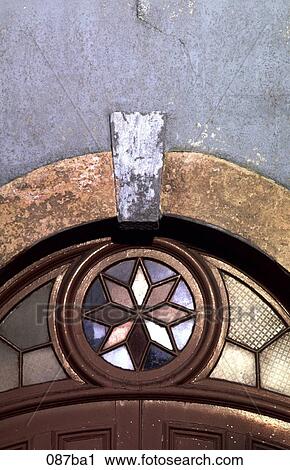 Stock Image - Stained Glass Window over Door. Fotosearch