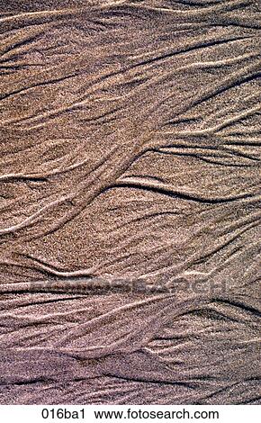 Stock Image - Texture of Water and Sand. Fotosearch