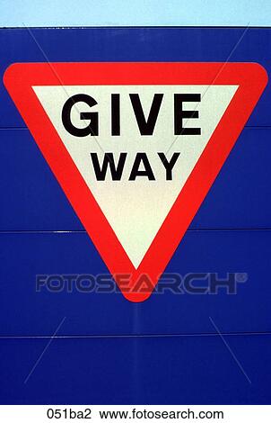 Stock Image - Give Way Sign on a Blue Background. Fotosearch