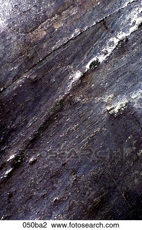 Stock Image - Water Flowing over Rock. Fotosearch