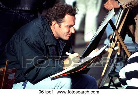 Stock Image - Artist Sitting and Looking at his Subject. Fotosearch