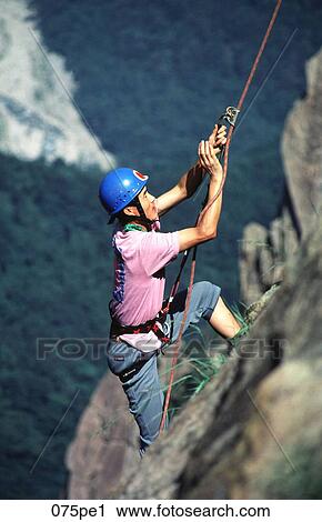 Asian Man Climbing Rockface Korea View Large Photo Image Stock Image - Asian Man Climbing Rockface Korea. Fotosearch