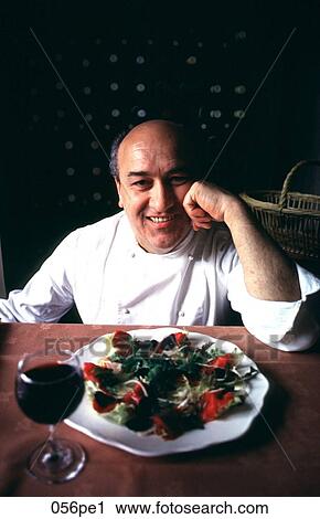 Chef Presenting a Plate of Food and Smiling View Large Photo Image Stock Image - Chef Presenting a Plate of Food and Smiling. Fotosearch