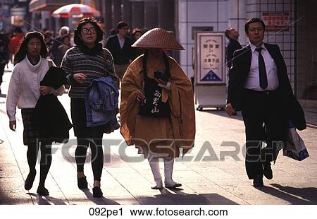 Stock Image - Contrasting Pedestrians Japan. Fotosearch