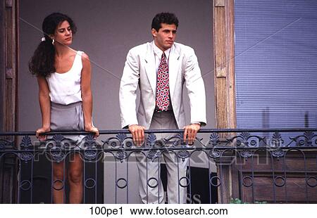 Stock Image - Man and Woman Standing on Balcony Argentina. Fotosearch