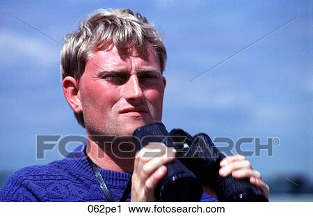 Man Holding Binoculars View Large Photo Image Stock Image - Man Holding Binoculars. Fotosearch