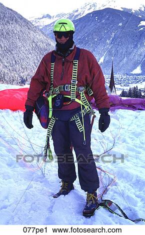 Man Standing with his Paraglider in the Snow Austria View Large Photo Image Stock Image - Man Standing with his Paraglider in the Snow Austria. Fotosearch