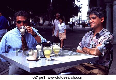Two Men Sitting Drinking at an Outdoor Cafe Mexico View Large Photo Image Stock Image - Two Men Sitting Drinking at an Outdoor Cafe Mexico. Fotosearch