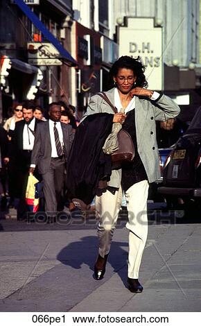Woman Wearing Glasses Walking along London Street View Large Photo Image Stock Image - Woman Wearing Glasses Walking along London Street. Fotosearch