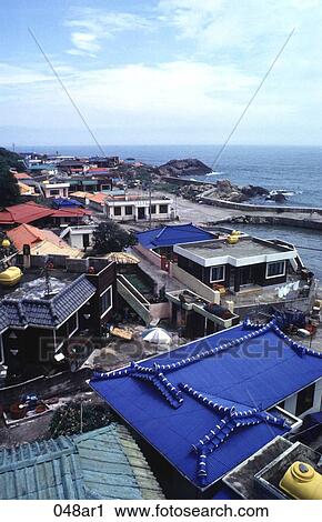 Stock Image - Blue Tiled Roof in Asian Fishing Town East Korea. Fotosearch