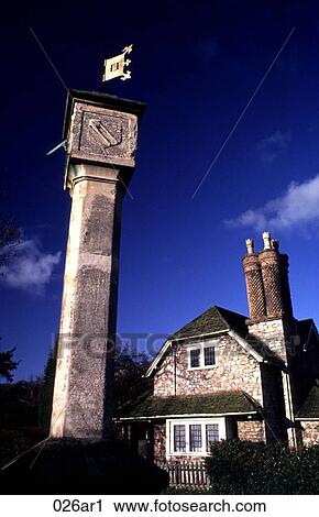Stock Image - Sun Dial and Stone Cottage Blaise Dell UK. Fotosearch