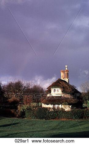 Stock Image - Thatched Cottage Britain UK. Fotosearch