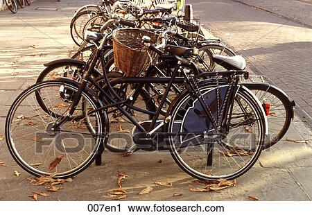 Bicycles Chained to Iron Railings UK View Large Photo Image Stock Image - Bicycles Chained to Iron Railings UK. Fotosearch