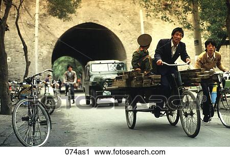 Man and Boy on Bicycle Cart on a Busy Street Xian China View Large Photo Image Stock Image - Man and Boy on Bicycle Cart on a Busy Street Xian China. Fotosearch